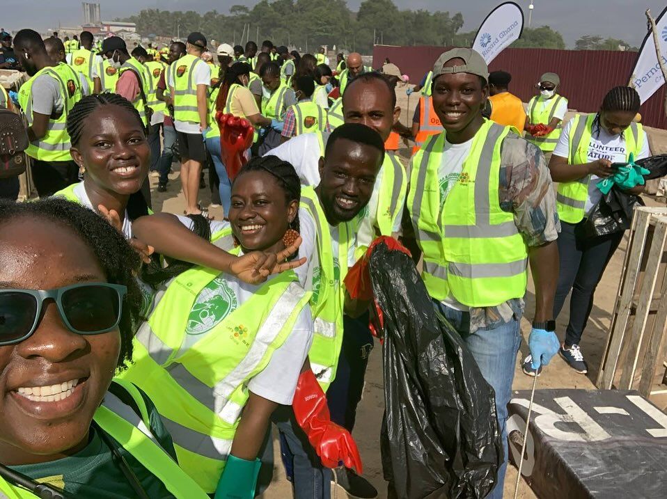 Volunteers taking a selfie during a beach clean-up